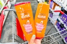 hand holding a bottle of L'Oreal Elvive shampoo and conditioner