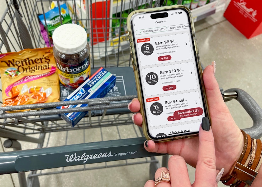 A person looking at coupons on the Walgreens app.