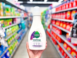 hand holding seventh generation fabric softener in walmart aisle