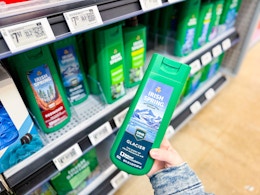 hand holding a bottle of irish spring body wash in walmart aisle