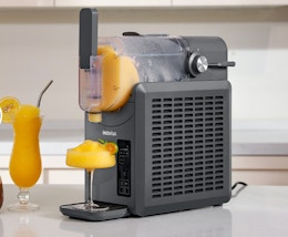 a slushie machine pouring out a drink