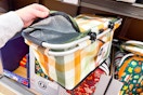 hand holding an aldi live in style foldable basket cooler