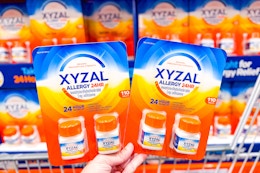 hand holding packs of xyzal