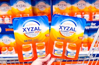 hand holding packs of xyzal