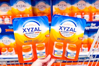 hand holding packs of xyzal