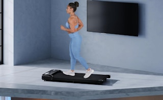 a person running on a walking pad