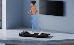 a person running on a walking pad