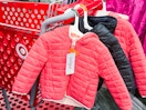 target coats sitting on a cart