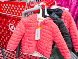 target coats sitting on a cart