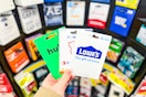 hand holding gift cards at dollar general