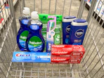 palmolive dish soap, crest and colgate toothpaste, garnier shampoo, nivea body wash in a cart
