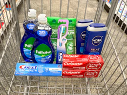 palmolive dish soap, crest and colgate toothpaste, garnier shampoo, nivea body wash in a cart
