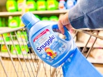 hand pulling the Snuggle fabric softener out of a Walmart cart