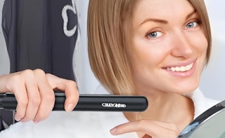 a woman using a mini flat iron