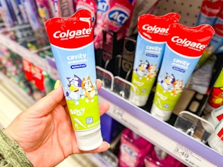 hand holding colgate bluey kids' toothpaste at target