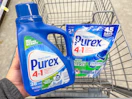 hand holding purex detergent and pacs in walgreens cart