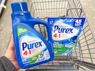 hand holding purex detergent and pacs in walgreens cart