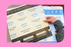 a woman opening amazon boxes