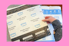 a woman opening amazon boxes