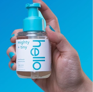 mouthwash concentrate bottle in a hand