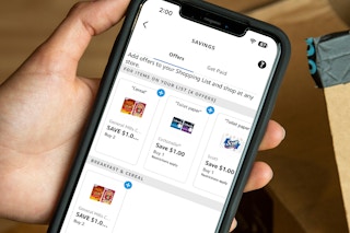 someone holding a phone displaying Alexa rebates for groceries