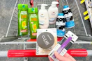 person holding covergirl setting powder and mascara over a cart with garnier shampoo, dove hand wash, and gillette foamy shave cream in it
