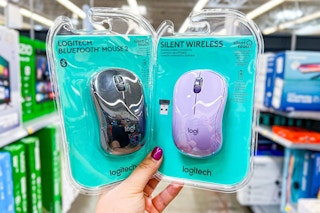 hand holding walmart-logitech-mouse