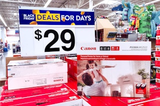 Canon Printers under $29 Black Friday sale sign in Walmart store