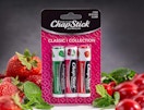 a 3-pack of Chapstick next to cherries and strawberries