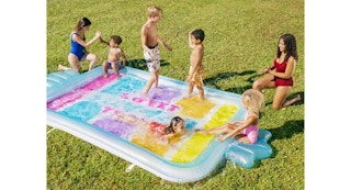 children playing on a splash pad