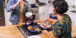 A couple enjoying grilled cheese from a frying pan