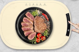 a woman using a warming mat