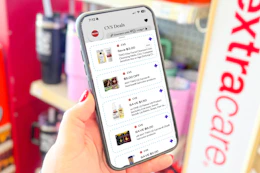 hand holding a smartphone displaying 1-clip coupons in the kcl app