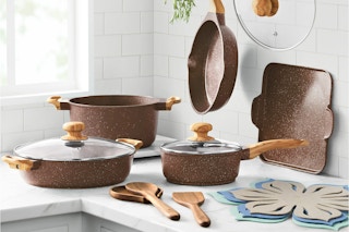 The Pioneer Woman Prairie Signature 14-Piece Cast Aluminum Cookware Set on a kitchen counter