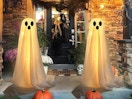 two ghost decorations outside a front door