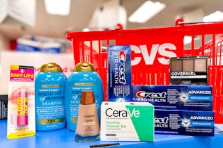 Maybelline, OGX, Covergirl, Cerave and Crest products on shelf with CVS basket in background