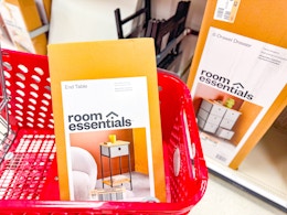 end table sitting in a target cart in front of a dresser on a shelf