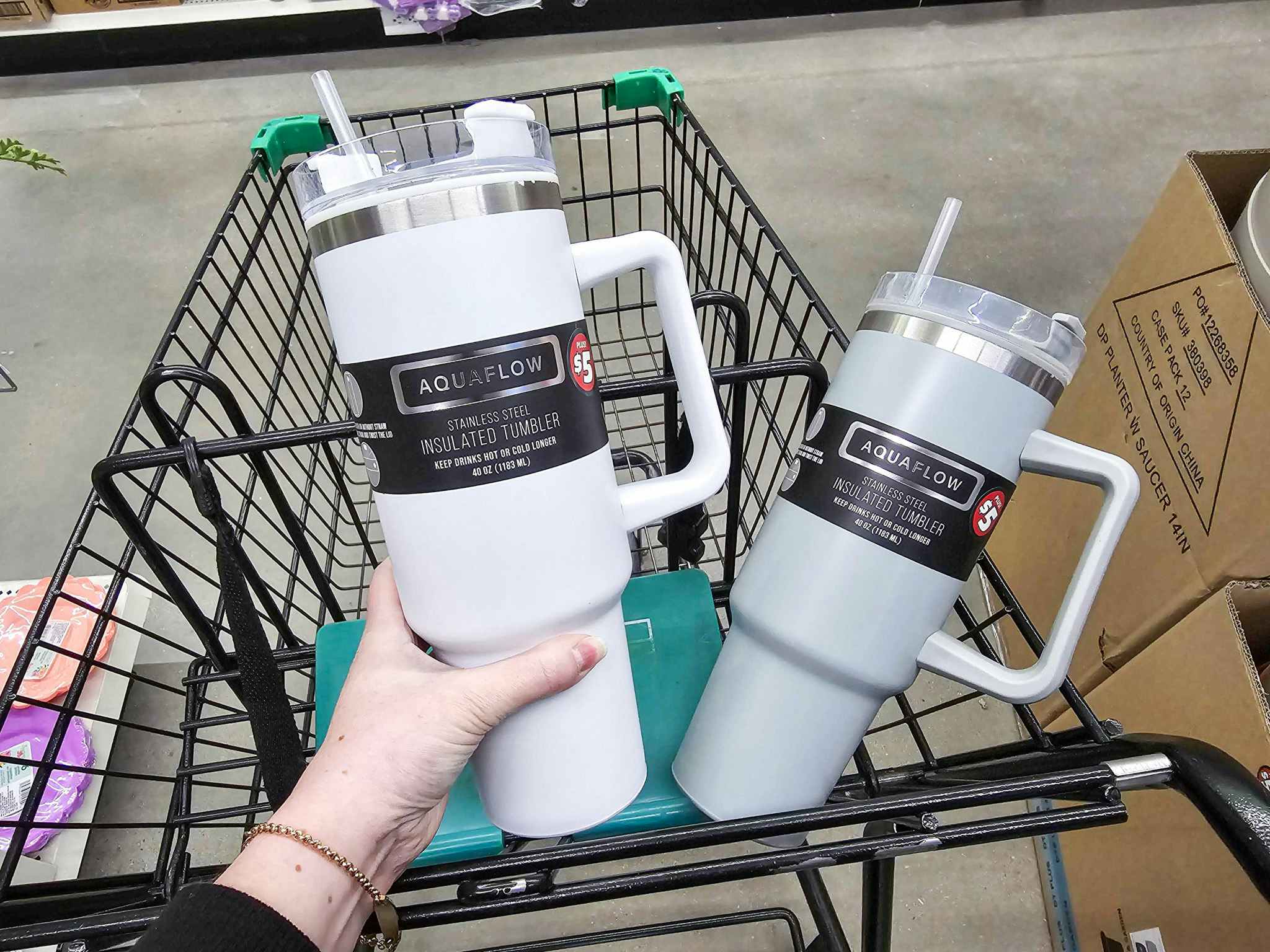 grey and white tumblers in a cart