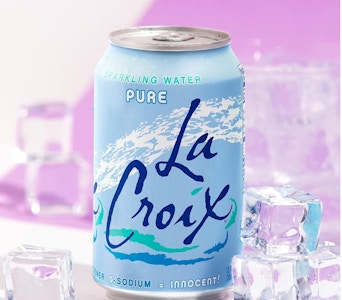 a blue can of sparkling water next to ice