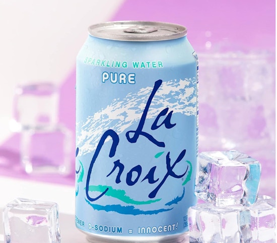 a blue can of sparkling water next to ice