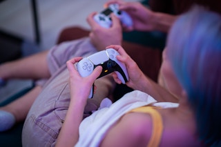 two people playing playstation