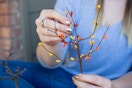 A floral pick being opened to look like a tree