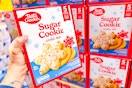 hand holding a box of betty crocker sugar cookie mix