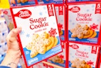 hand holding a box of betty crocker sugar cookie mix