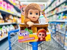 Little Live Pet Money on edge of Walmart shopping cart