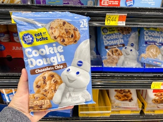 hand holding pillsbury cookie dough at walmart