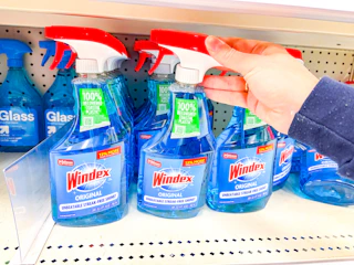 grabbing a windex glass cleaner off a target shelf