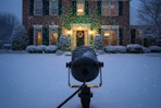 a christmas lights projector on a home