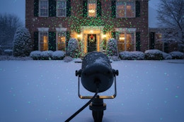 a christmas lights projector on a home