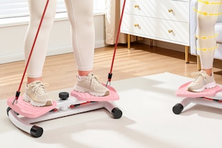 woman standing on waist twister machine